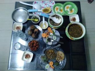 Rakesh's wife and mother in law treating me to a North Indian meal.