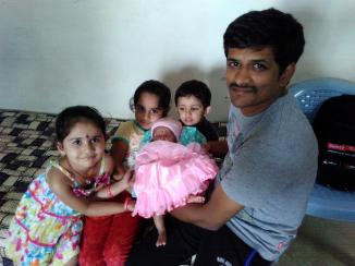 A very proud Sandeep with his baby daughter. Also present are his cousins daugther, his sister's daughter and his own son.